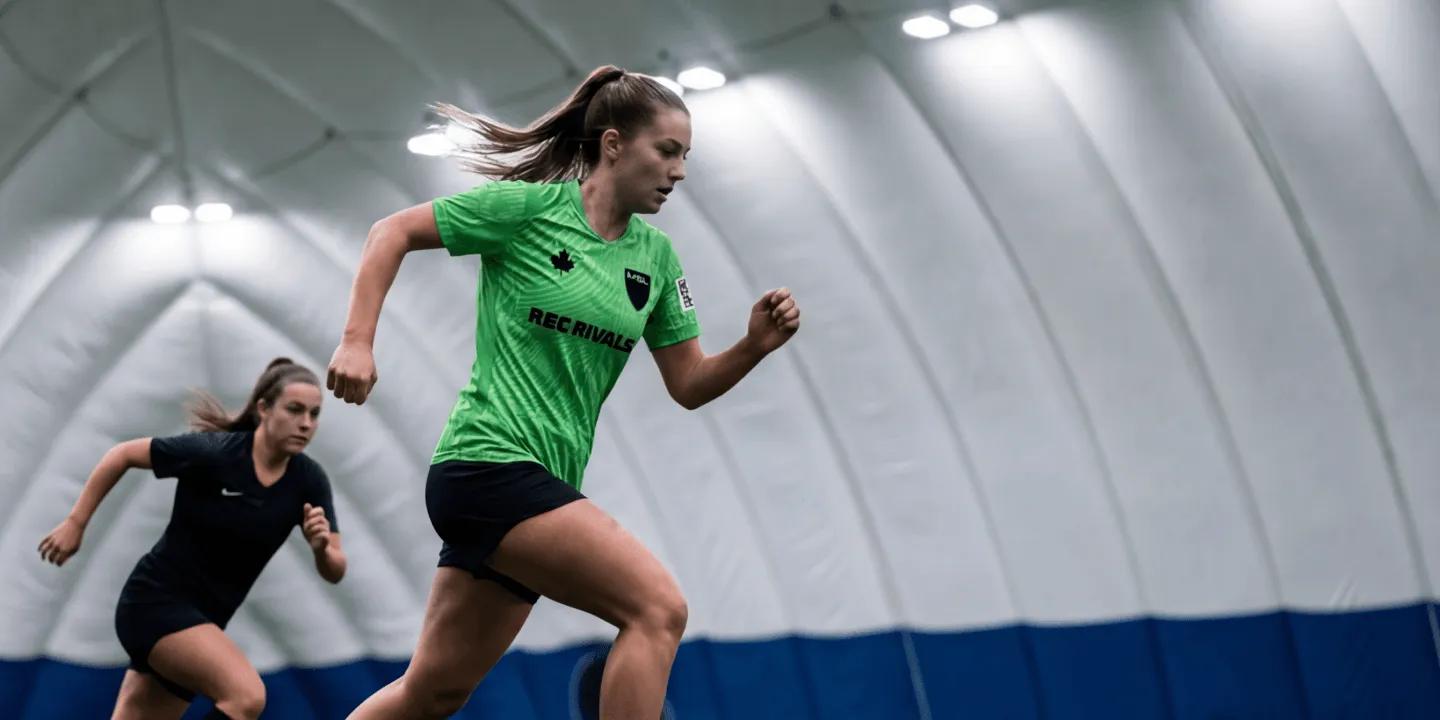 Women playing in an adult coed indoor soccer league in Toronto