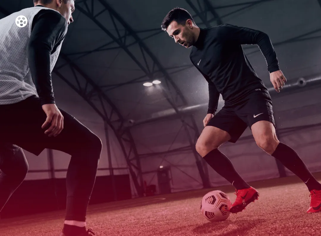 Adult players competing in an indoor soccer game in Toronto